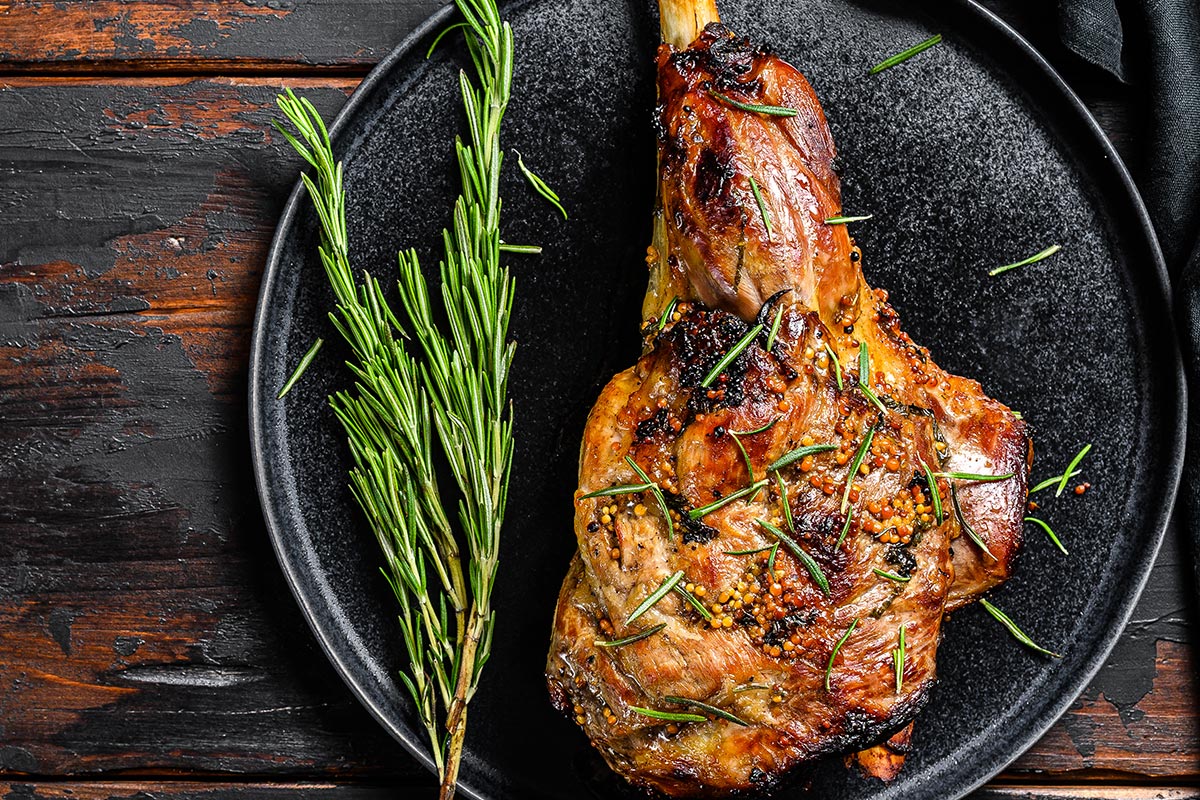 roast leg of lamb and rosemary sprig