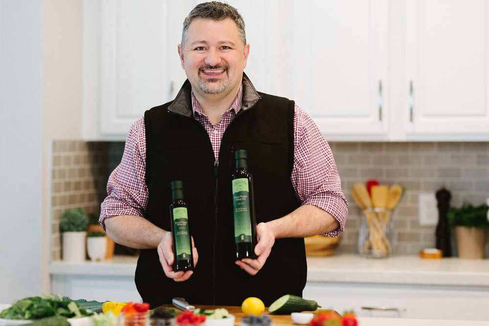 T. J. Robinson holding olive oil